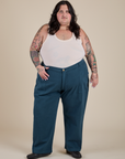 Sam is 5’10” and wearing 4XL Work Pants in Lagoon paired with vintage tee off-white Tank Top