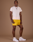 Angled front view of Classic Work Shorts in Sunshine Yellow and Organic Vintag Tee in Vintage Off White
