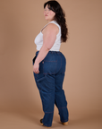 Angled back view of Carpenter Jeans in Dark Wash on Ashley