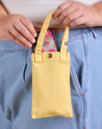 Cell Phone Tote in Butter Yellow held by model