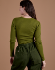 Gingham Long Sleeve Baby Tee in Summer Olive back view on Alex