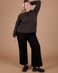 Lish is wearing Long Sleeve Burly Tee in Espresso Brown and black Western Pants