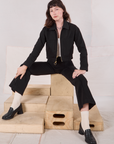 Alex is wearing Mechanic Jacket in Basic Black and black Western Pants