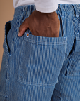 Close up of Isaac's hand in the back pocket of Railroad Denim Work Pants in Natural