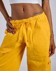 Close up of Drop Pocket Cargo Pants in Sunshine Yellow on Kira