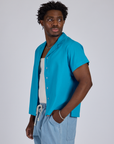 Angled front view of Pantry Button-Up in Hawaiian Blue on Isaac
