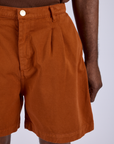 Front close up of Pleated Trouser Shorts in Burnt Terracotta on Jerrod