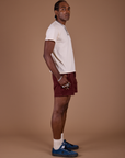 Side view of Classic Work Shorts in Red Wine and Organic Vintage Tee in Vintage Off White on Jerrod