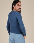 Long Sleeve Baby Tee in French Blue angled back view on Anthony