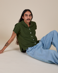 Anthony is wearing Pantry Button-Up in Evergreen