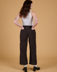 Corduroy Drop Pocket Cargo Pants in Espresso Brown back view on Alex