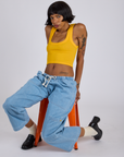 Cropped Tank Top in Sunshine Yellow and light wash Denim Drop Pocket Pants on Kira
