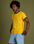 Angled front view of Vintage Ringer Tee in Sunshine Yellow on Jerrod