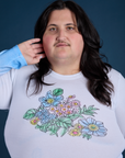 Floral Long Sleeve Baby Tee in Baby Blue front close up on Sam