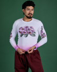 Jesse is wearing Floral Long Sleeve Baby Tee in Pink
