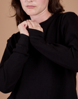 Long Sleeve Burly Tee in Basic Black front close up on Alex