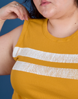 Painted Muscle Tee in Mustard Yellow front close up on Ashley