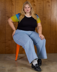Calypso Tee in Black Multi and light wash denim wide leg trousers on Juliet