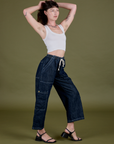 Side view of Denim Drop Pocket Pants in Dark Wash and Cropped Tank in Vintage Tee White on Alex