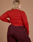 Gingham Long Sleeve Baby Tee in Mustang Red back view on Juliet