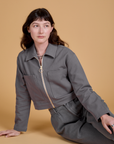 Alex is wearing Heritage Mechanic Jacket in Washed Grey