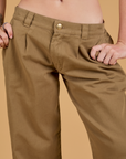 Baggy Mid-Rise Trousers in Desert Brown front close up on Alex