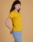Side view of Organic Vintage Tee in Sunshine Yellow on Alex