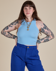 Sydney is 5’9” and wearing XXS Racerback Tank in Baby Blue