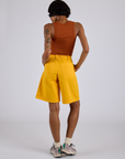 Back view of Longline Work Shorts in Sunshine Yellow and burnt terracotta Cropped Tank