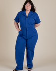 Ashley is 5'7" and wearing 1XL Sleeve Jumpsuit in Royal Blue