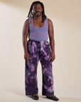 Demi is 5'6" and wearing S Magic Waters Drop Pocket Pants in Dark Lavender paired with faded grape Cropped Tank