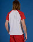 Back view of Produce Raglan Tee in Tomato on Grant