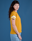 Painted Burly Tee in Mustard Yellow side view on Alex