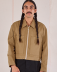Anthony is 5’10 and wearing S Mechanic Jacket in Desert Brown
