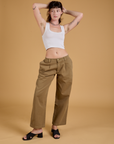 Alex is wearing Baggy Mid-Rise Trousers in Desert Brown and vintage tee white Cropped Tank