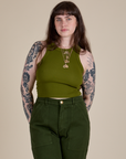 Sydney is 5’9” and wearing XXS Racerback Tank in Summer Olive