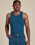 Isaac is 5’10” and wearing S Racerback Tank in Lagoon