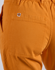 Work Pants in Creamsicle Orange back pocket close up