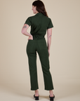 Back view of Short Sleeve Jumpsuit in Swamp Green on Alex