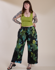 Sydney is wearing Magic Waters Drop Pocket Pants in Green Pool and gross green Cropped Tank