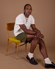 Jerrod is wearing Classic Work Shorts in Surplus Green and Organic Vintage Tee in Vintage Off White
