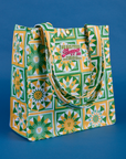 Angled front view of Spring Quilt Printed Shopper Tote