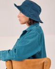 Tiara is wearing Wide Brim Denim Bucket Hats