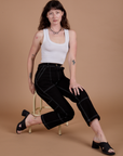 Carpenter Jeans in Black and vintage tee white Cropped Tank worn by Alex