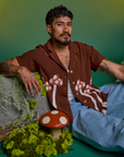 Jesse is wearing Paintstamped Pantry Button-Up in Mushroom