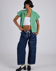 Kira is wearing Pantry Button-Up in Seafoam Green and dark wash Denim Drop Pocket Pants