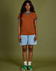 Vintage Ringer Tee in Burnt Terracotta and light wash Carpenter Shorts on Kandia