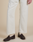 Short Sleeve Jumpsuit in Vintage Tee White pant leg close up on Quinn