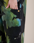 Close up of Sydney's hand in the Magic Waters Drop Pocket Pants in Green Pool pant leg pocket
