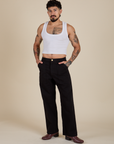 Jesse is 5’8” and wearing S Work Pants in Basic Black paired with vintage tee white Cropped Tank